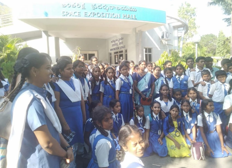 Students learning about weaving process